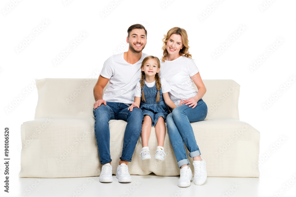 happy european family sitting on sofa, isolated on white happy european family sitting on sofa, isolated on white