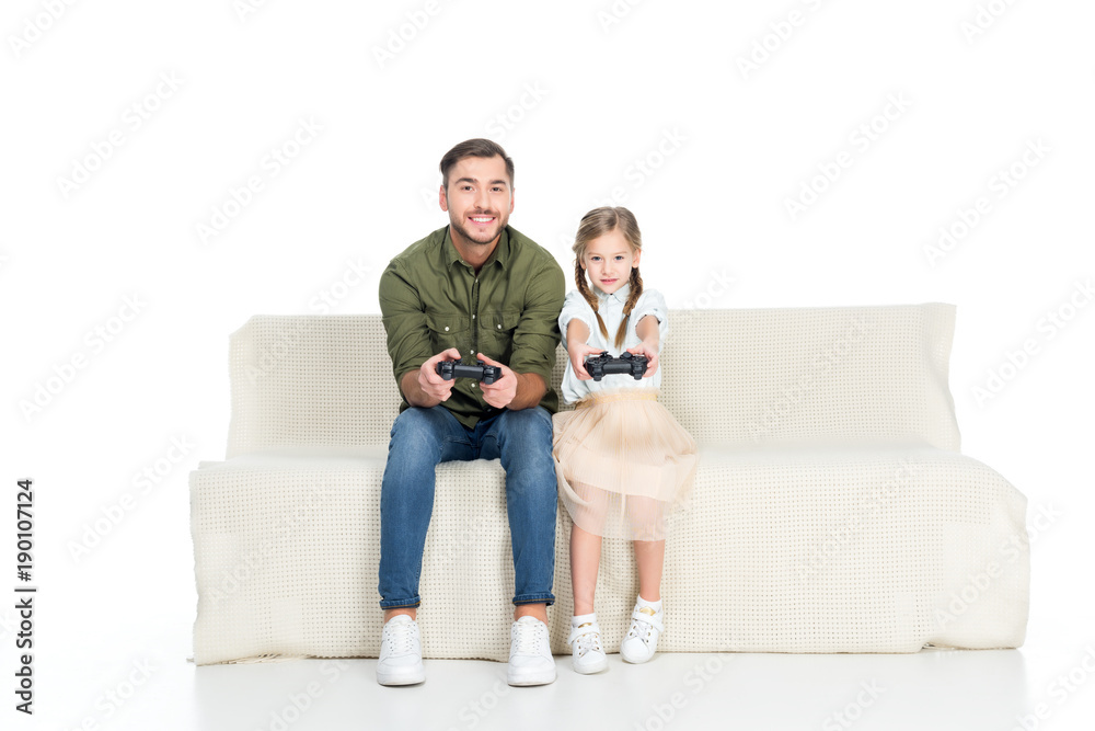 smiling father and daughter playing video game together isolated on white smiling father and daughter playing video game together isolated on white