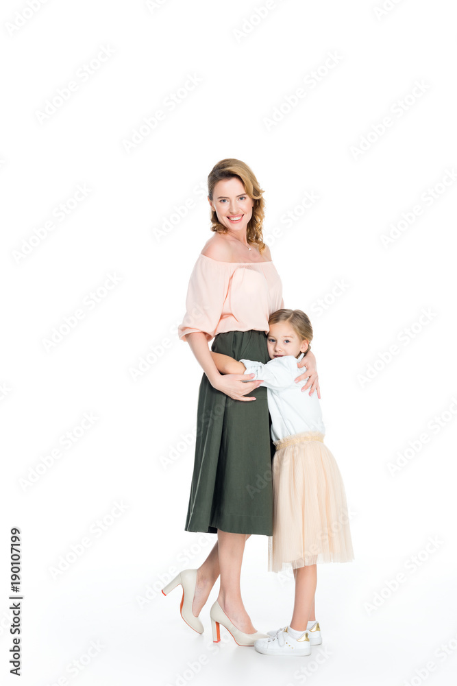 daughter hugging smiling mother isolated on white daughter hugging smiling mother isolated on white