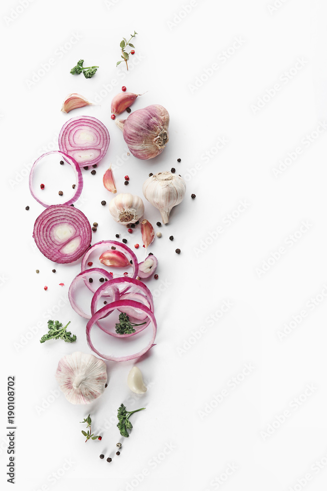 Fresh garlic, onion and pepper grains on white background, top view Fresh garlic, onion and pepper grains on white background, top view