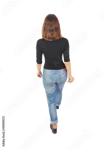 back view of walking woman.