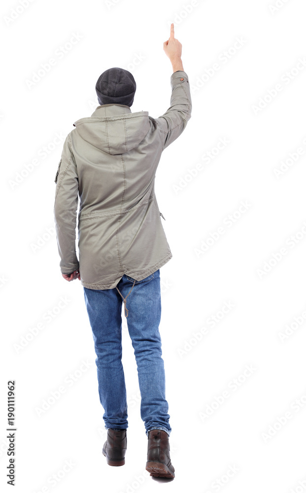 Back view of pointing young men in shirt and jeans. Back view of pointing young men in shirt and jeans.
