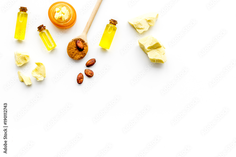 Cocoa butter as ingredient for natural cosmetics. White background top view copy space Cocoa butter as ingredient for natural cosmetics. White background top view copy space