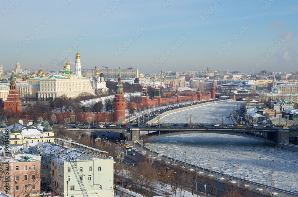 View of the Moscow Kremlin, Big Stone bridge and the Moscow-river from the observation platform of Cathedral of Christ the Saviour on a Sunny winter day, Moscow, Russia
