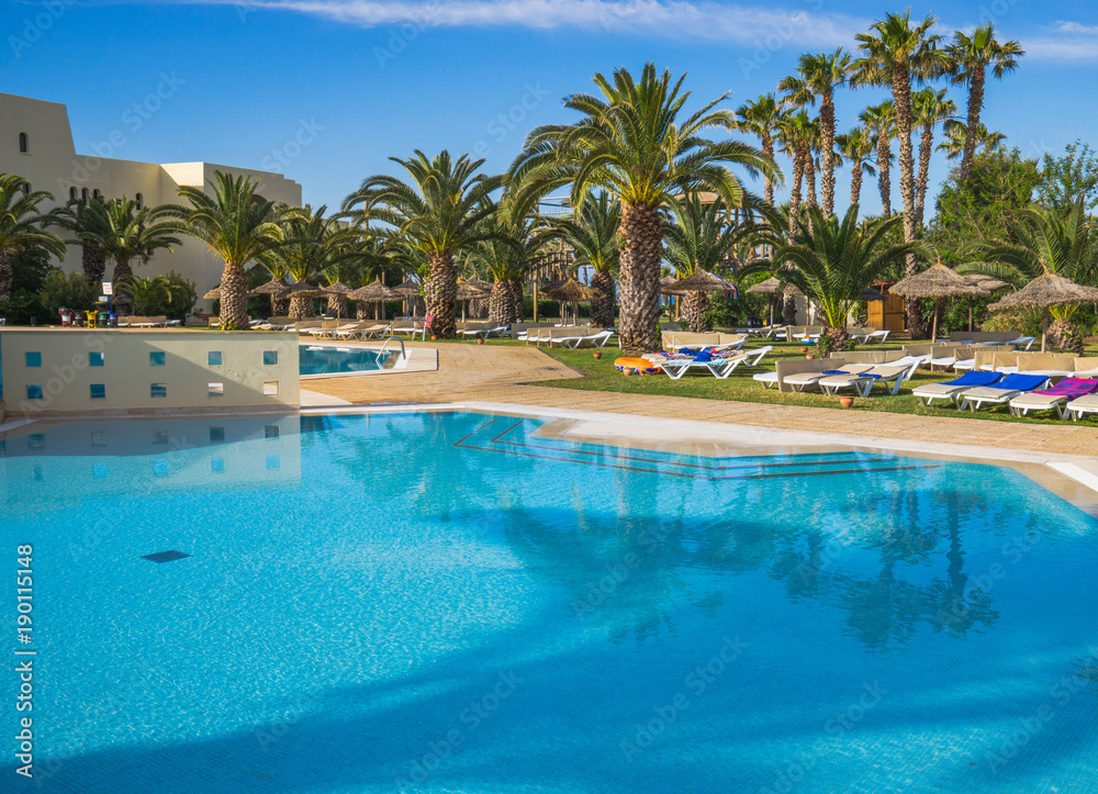 Large Swimming pool and trees at resort