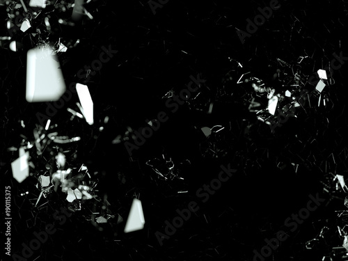 Pieces of splitted or cracked glass on black in the dark
