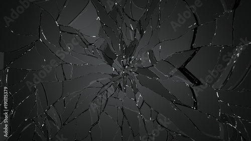 Pieces of shattered or cracked glass on black