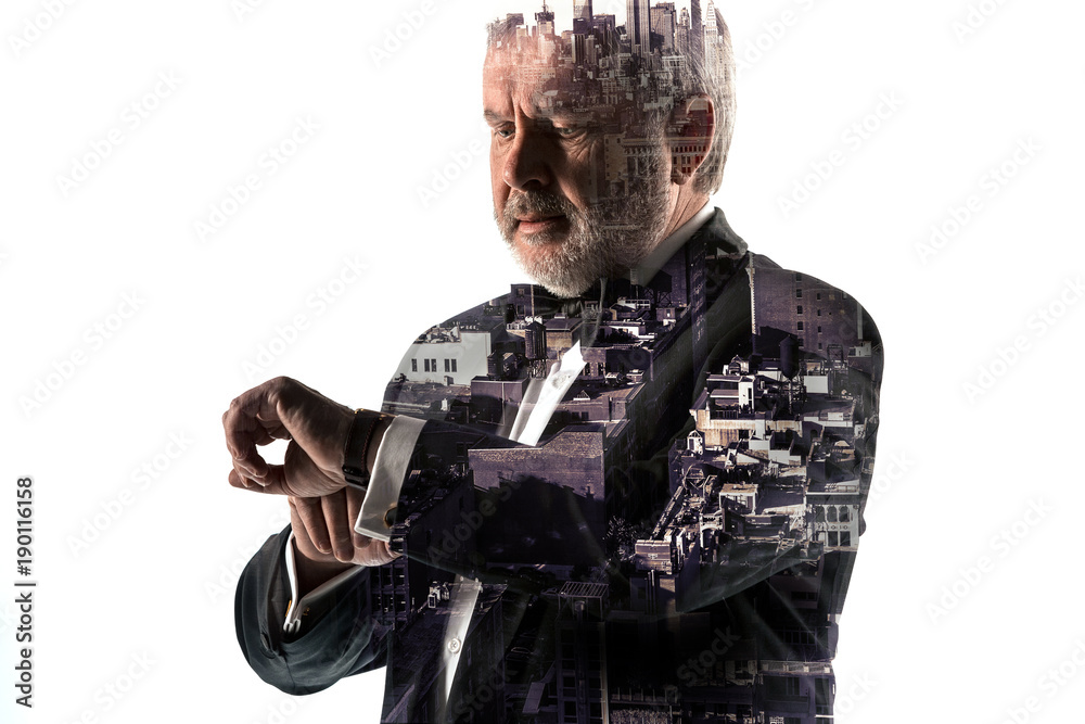 Fototapeta premium Portrait of bearded businessman. Double exposure city on the background.