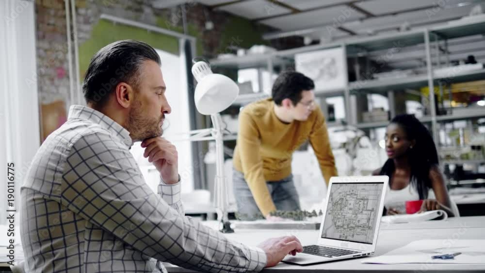 Man working in design and engineering architecture office Man working in design and engineering architecture office