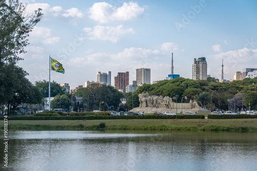 Bandeiras Monument, Ibirapuera Park and city skyline with brazilian flag - Sao Paulo, Brazil