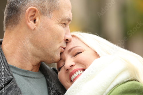 Happy mature couple kissing...