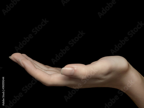 female hand on black background