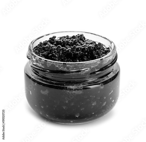 Black caviar in glass jar on white background