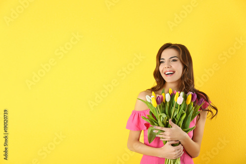 Beautiful woman holding bou...