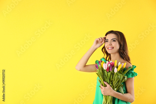 Beautiful woman holding bou...