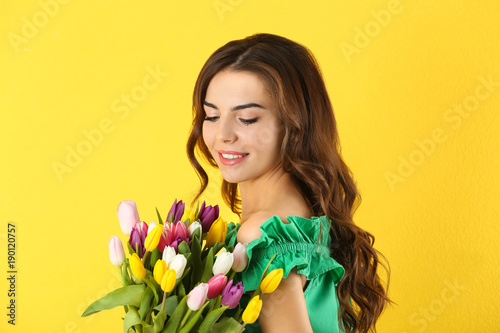 Beautiful woman holding bou...
