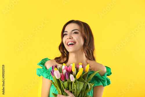 Beautiful woman holding bou...