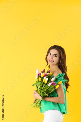 Beautiful woman holding bou...