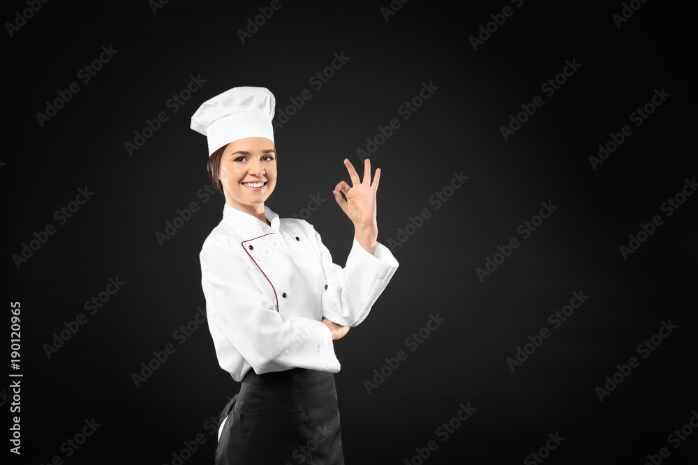 Portrait of female chef on black background Portrait of female chef on black background