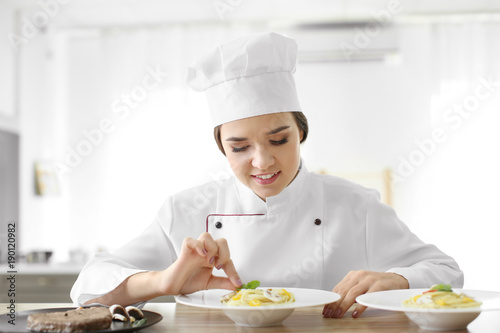 Female chef preparing tasty...