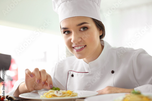 Female chef preparing tasty...