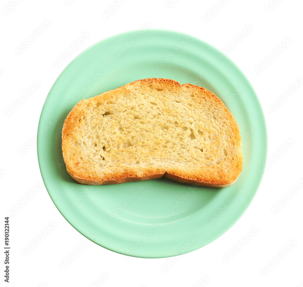 Plate with toasted bread on white background
