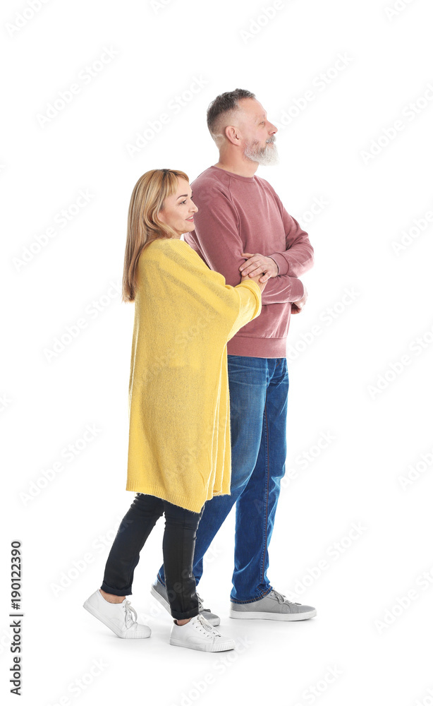 Mature couple in casual clothes walking on white background Mature couple in casual clothes walking on white background