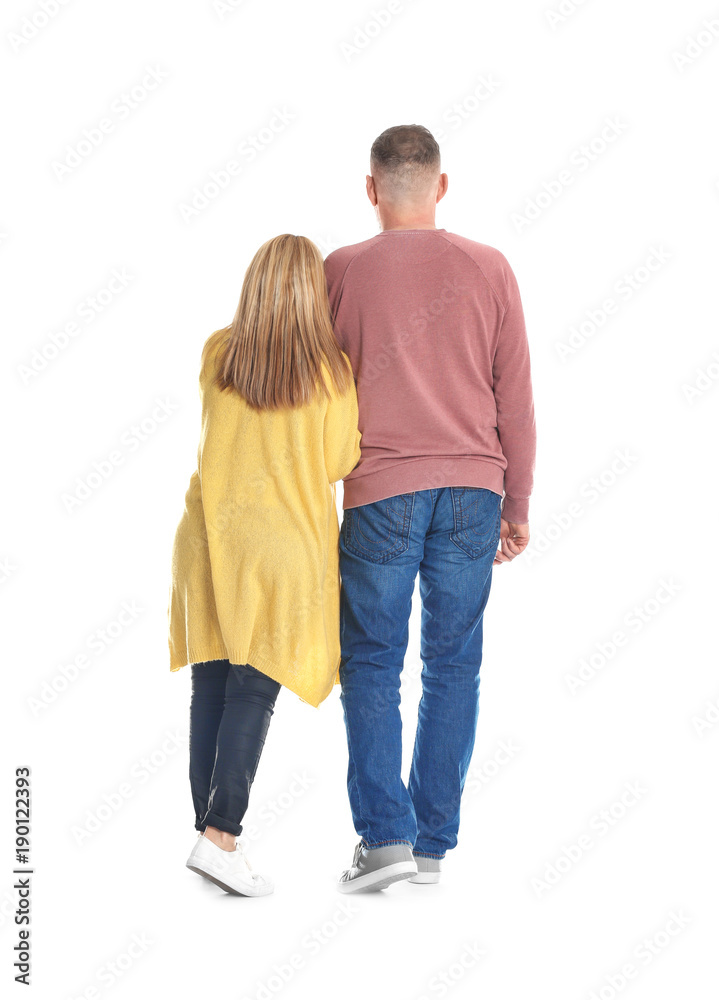 Mature couple in casual clothes walking on white background