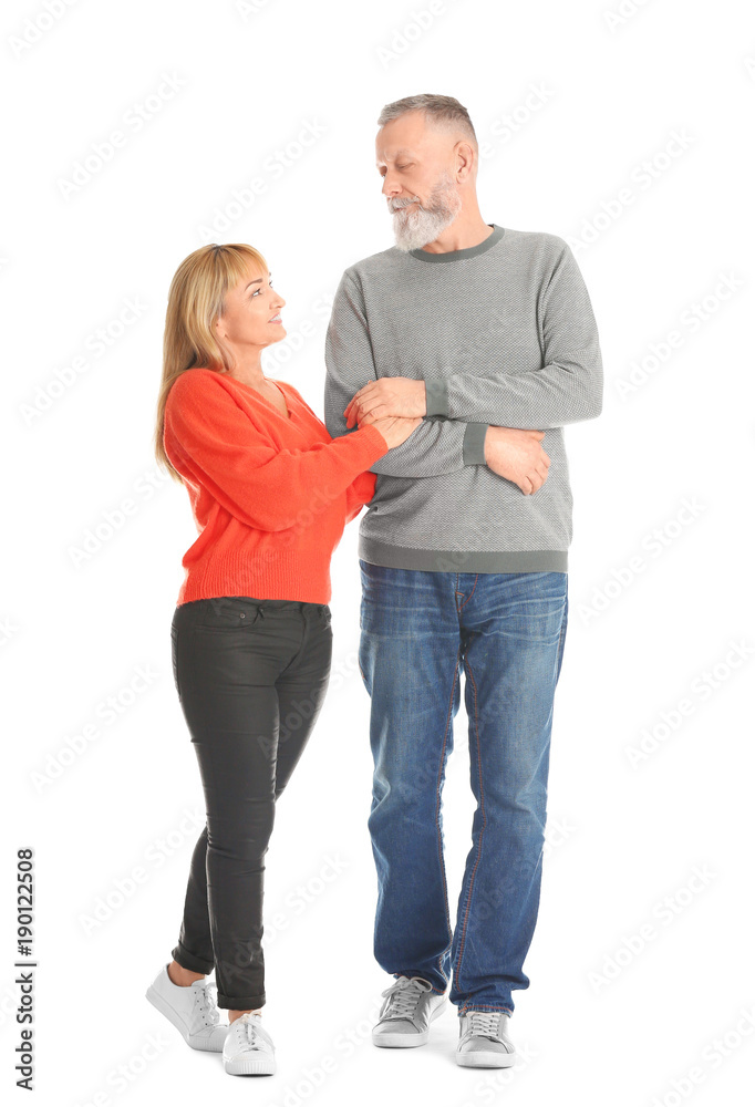 Mature couple in casual clothes walking on white background Mature couple in casual clothes walking on white background