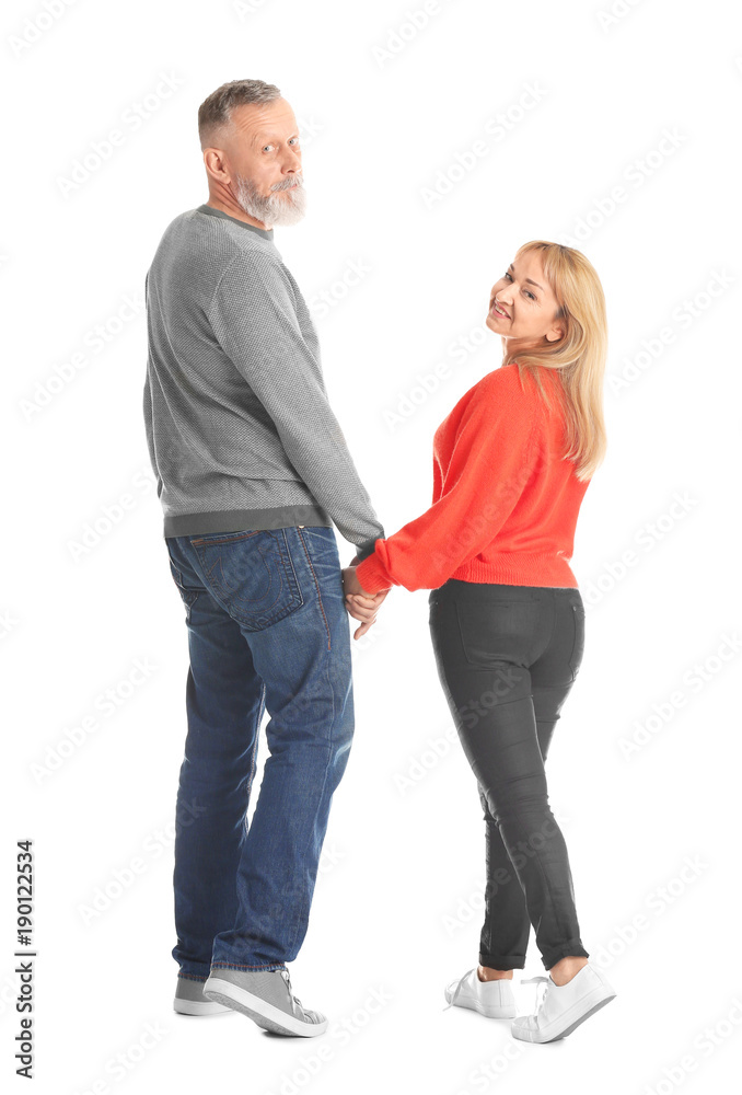 Mature couple in casual clothes walking on white background Mature couple in casual clothes walking on white background