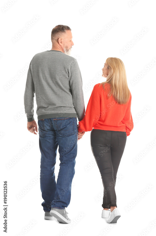 Mature couple in casual clothes walking on white background Mature couple in casual clothes walking on white background