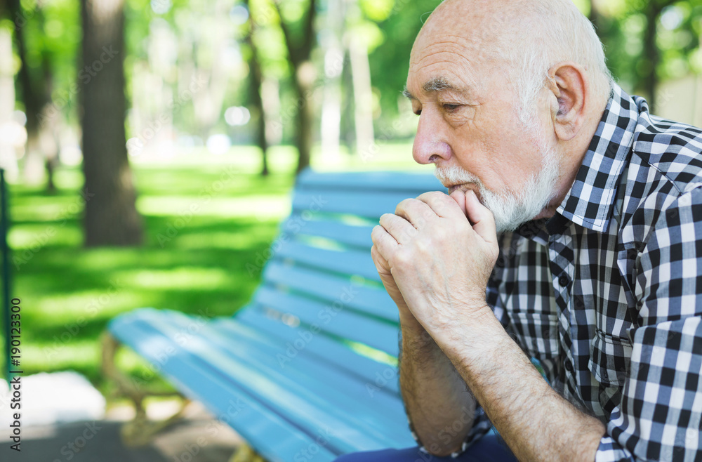 Fototapeta premium Pensive senior man outdoors