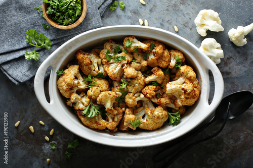 Roasted cauliflower with pine nuts and parsley photo