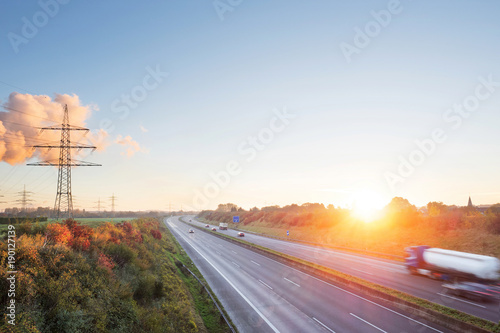 Highway transportation traffic at sunrise. Germany