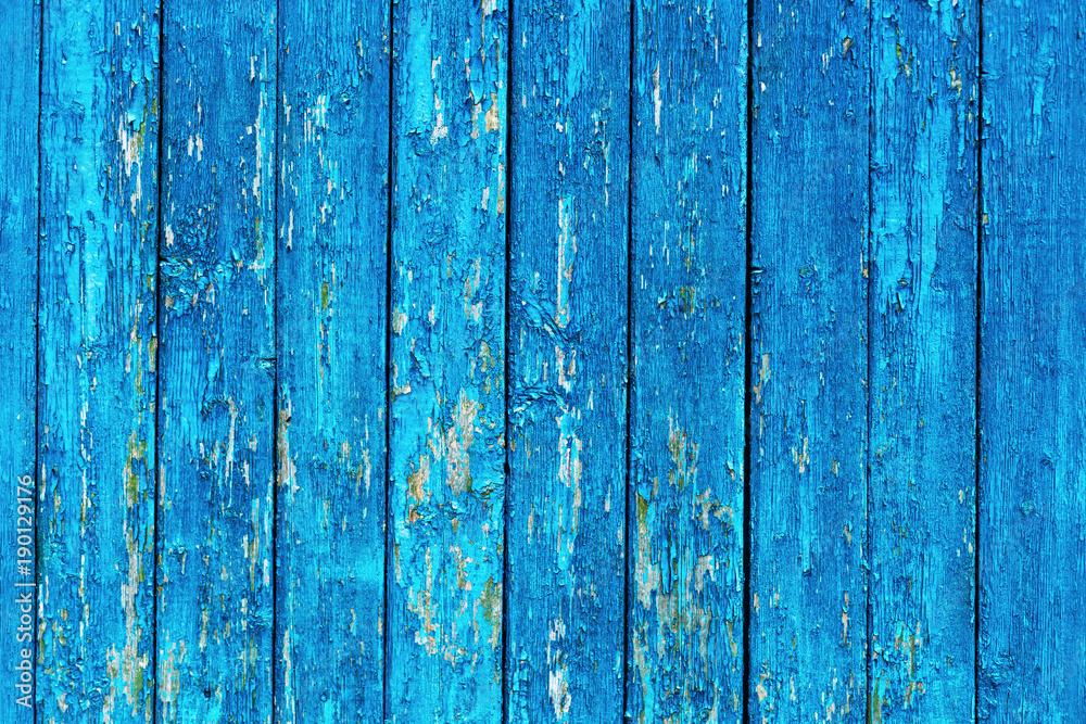 old wooden wall with a blue paint that is exfoliated old wooden wall with a blue paint that is exfoliated