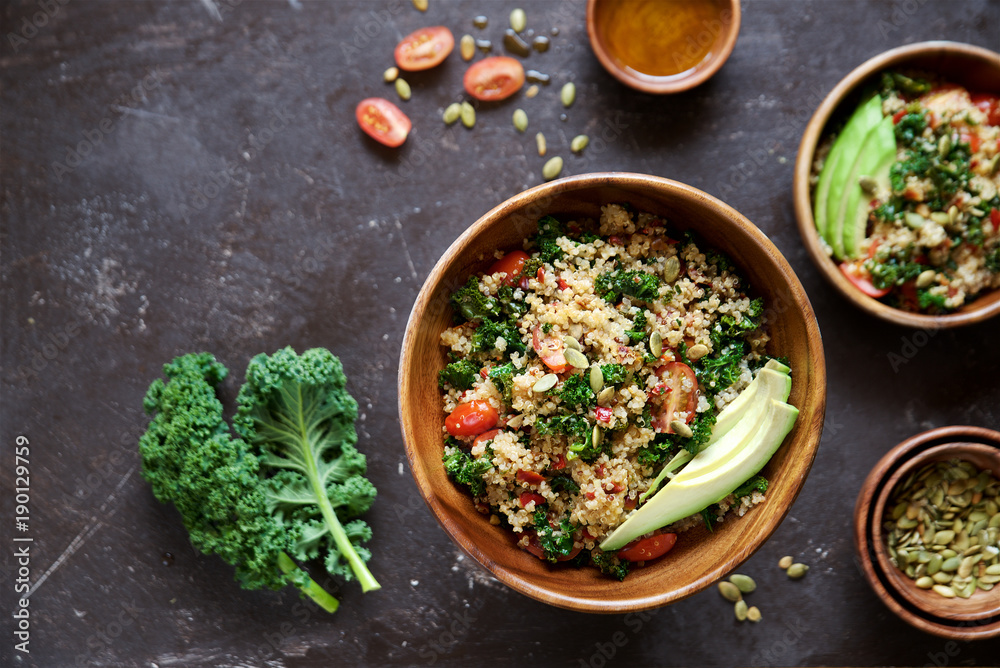 Quinoa salad with kale, cherry tomatoes and pumpkin seeds
