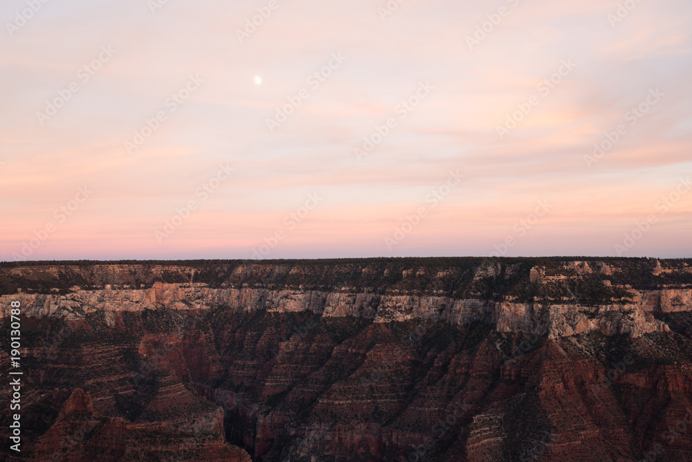 Pink sky above the Grand Canyon in Arizona after sunset. 