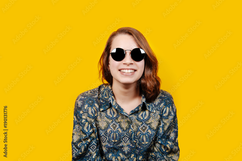 Fototapeta premium Photo of excited happy young woman standing isolated over yellow background. Looking camera.