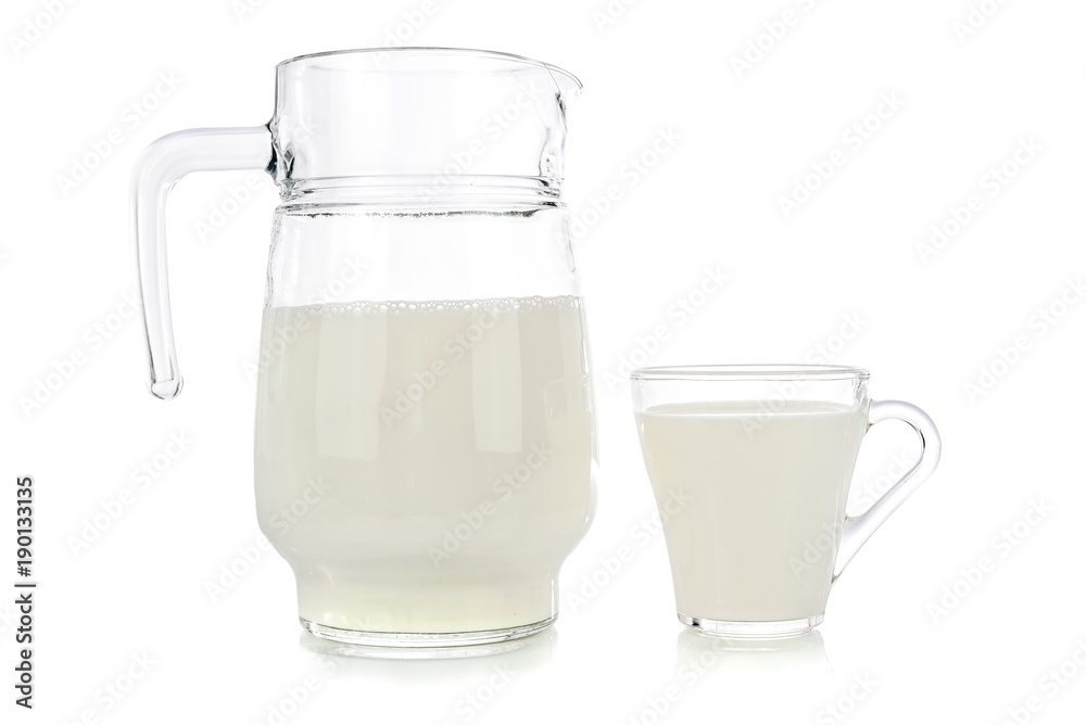 Glass and jug of fresh milk isolated on white background. Glass and jug of fresh milk isolated on white background.