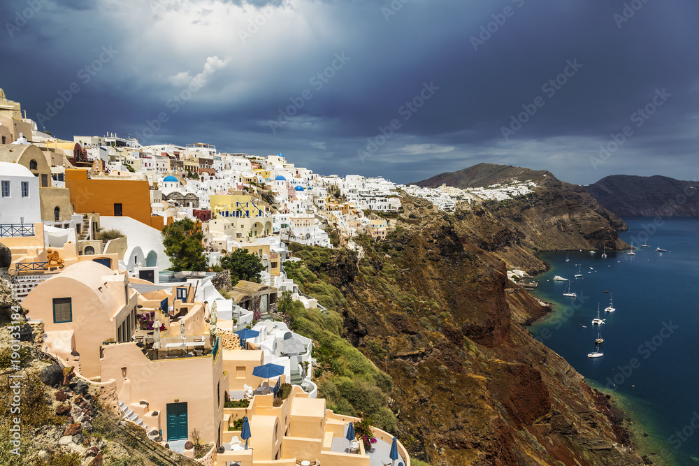 View of the city of Oia on the island of Santorini and the waters of the Aegean Sea in Greece