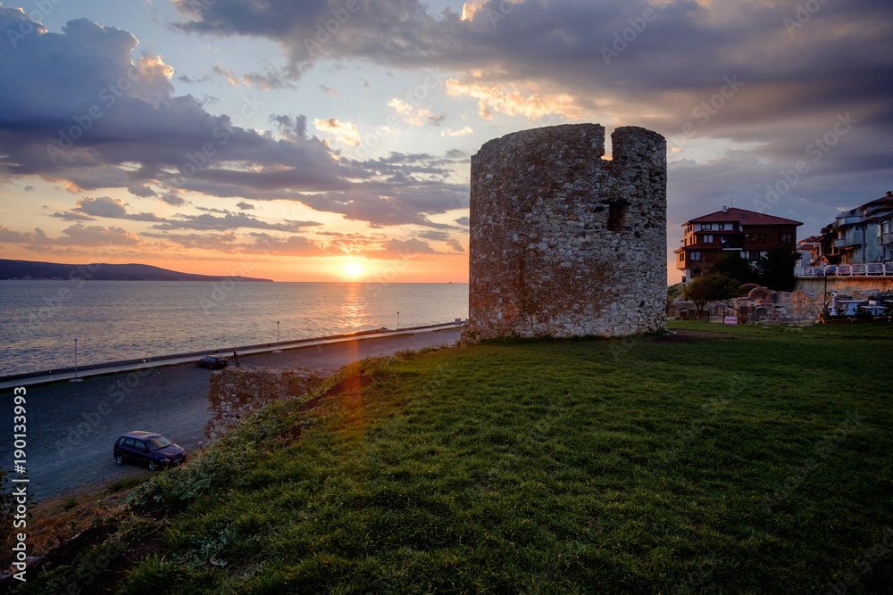 Ruins of the castle tower with the Black Sea coast in Nesebar, Bulgaria