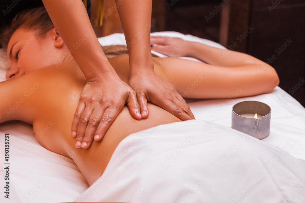 Fototapeta premium Woman getting thai massage treatments in spa.