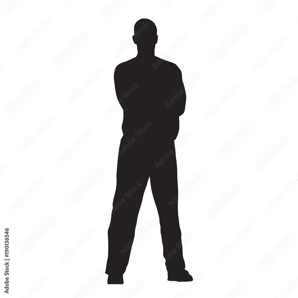 Man stands with his legs crooked and his arms folded, isolated vector silhouette
