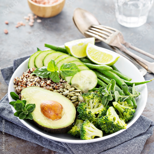 Green vegan lunch bowl with quinoa and avocado