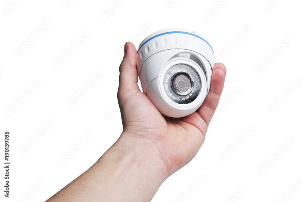 Installation of a CCTV camera. Dome security camera in the hands of a man. Installation of a CCTV camera. Dome security camera in the hands of a man.