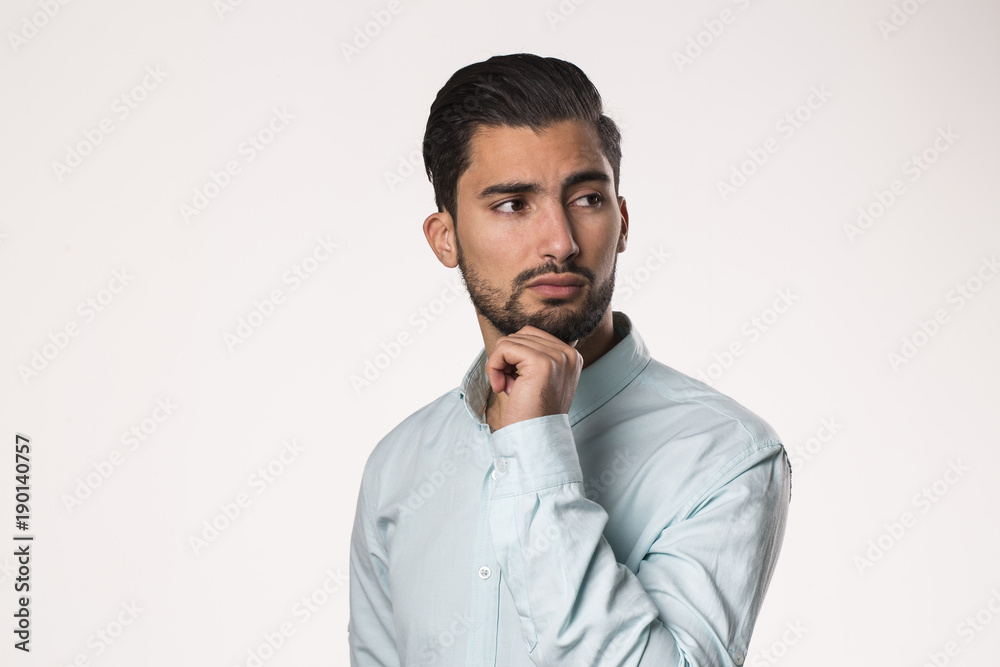 young man thinking and looking on the side , isolated on white young man thinking and looking on the side , isolated on white