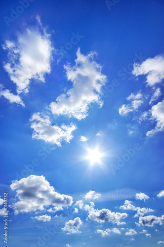 Deep blue sky with clouds at sunny day.