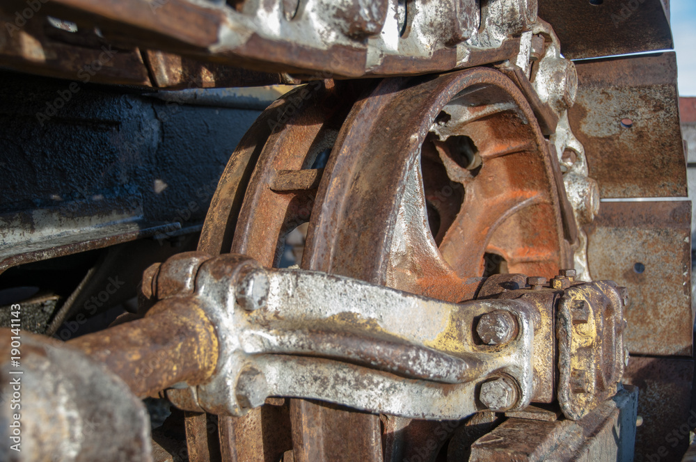 Closeup and Selective Focus Rusty Wheel of Earth Mover Caterpillar Track.
