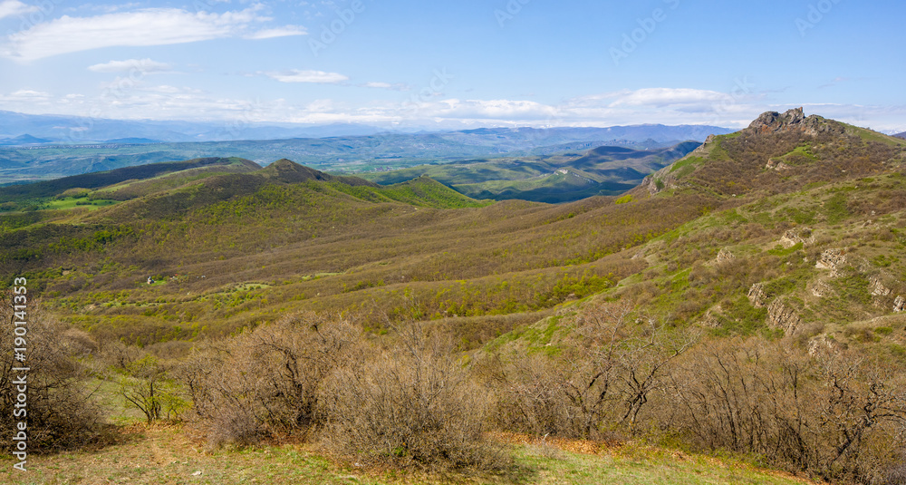Mountains and hills with trees against blue sky. Georgia. Mountains and hills with trees against blue sky. Georgia.