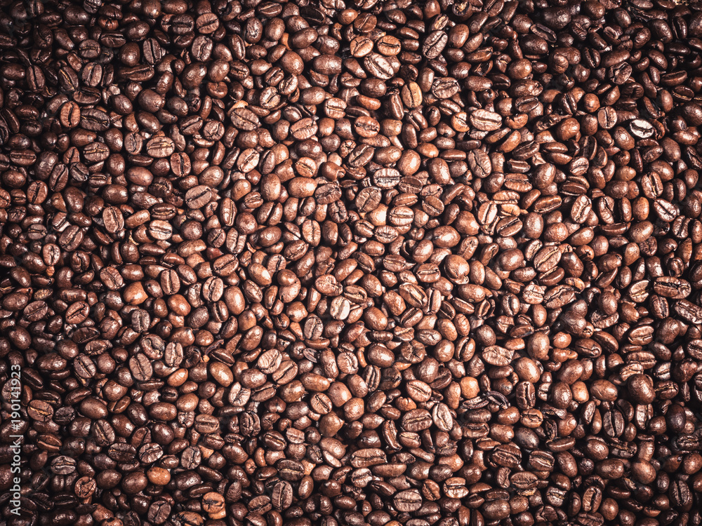 Background of roasted coffee grains Food backdrop macro close-up Background of roasted coffee grains Food backdrop macro close-up